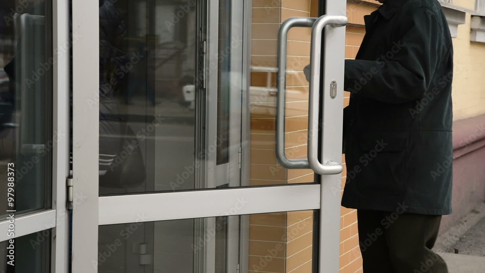 People are entering into the door People are entering into the door