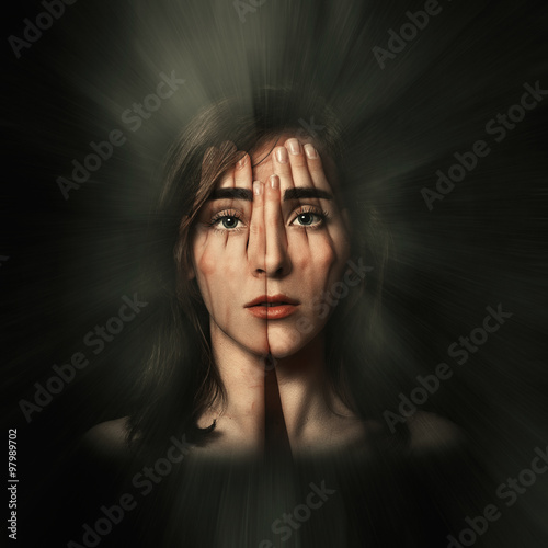 Obraz na plátně Surreal portrait of a young girl covering her face and eyes with her hands