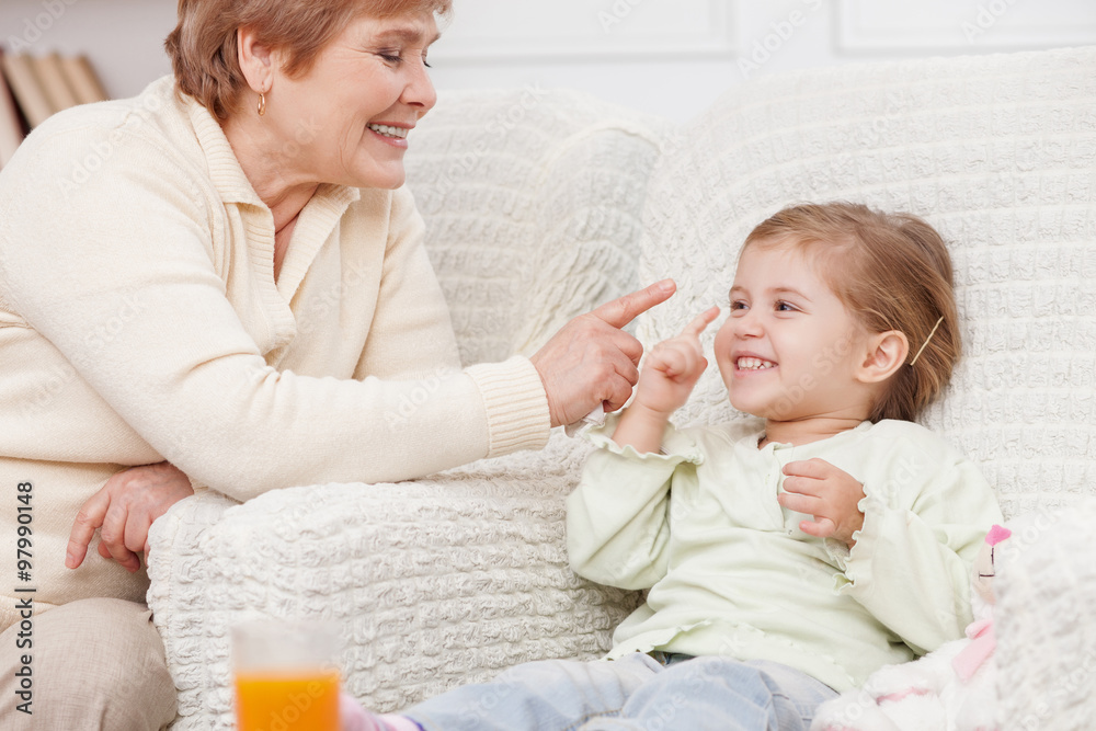 Cheerful grandparent and child are making fun Cheerful grandparent and child are making fun