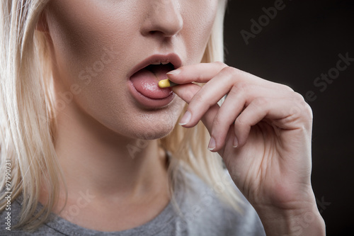 Tablou pe pânză Depressed young female druggie is receiving ecstasy