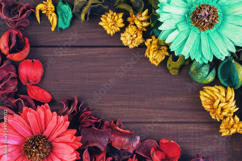 Dried flowers on a wooden background