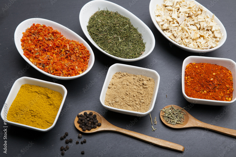 Powder spices on spoons and bowl Powder spices on spoons and bowl
