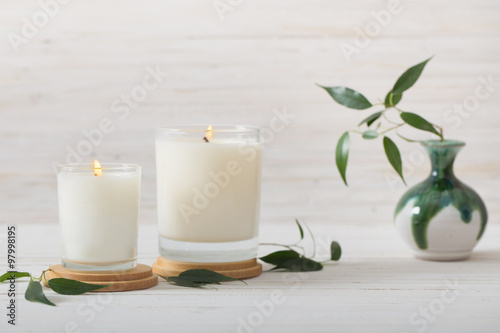 scented candles on white background