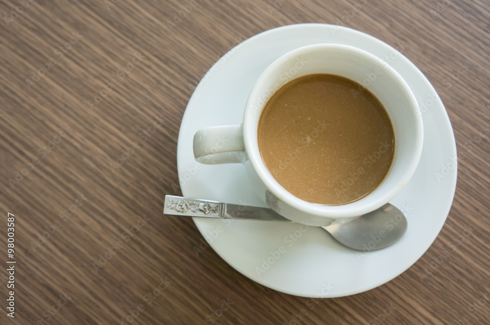 top view, coffee in white cup, wood background top view, coffee in white cup, wood background