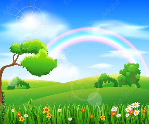 Nature background with green grass and flowers and blue sky