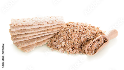 Oat flakes with spoon and toasts photo