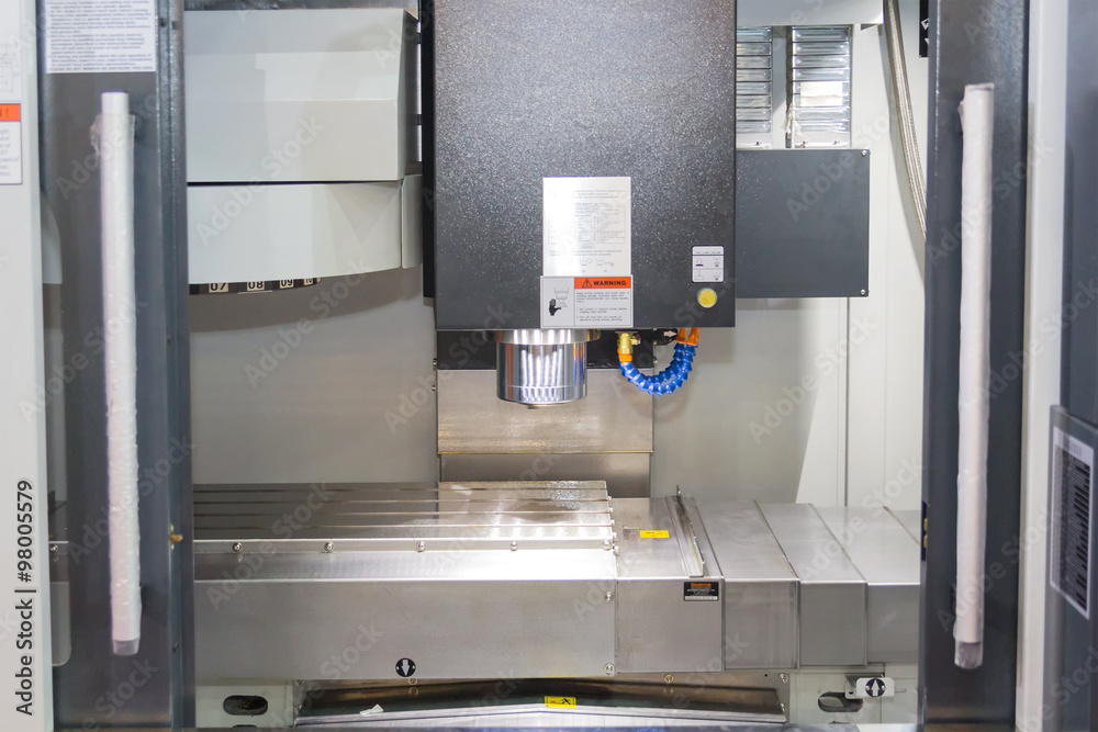 CNC milling machine center in tool manufacture workshop CNC milling machine center in tool manufacture workshop