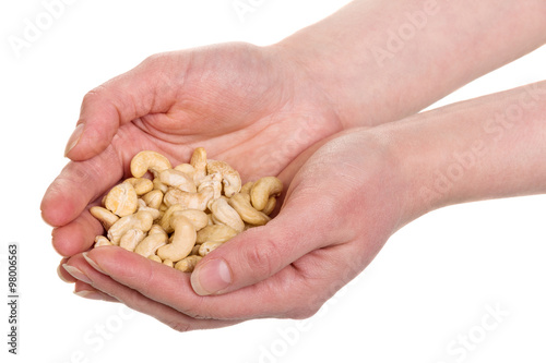 Roasted cashew nuts in hands