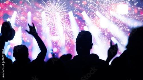 Fototapeta Naklejka Na Ścianę i Meble -  New Year concept - cheering crowd and fireworks