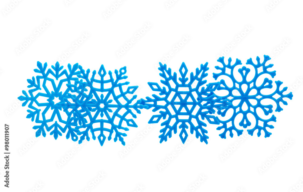 Studio close-up of a bright blue snowflake ornament