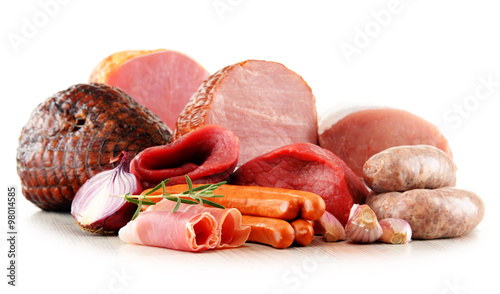 Meat products including ham and sausages isolated on white photo