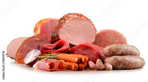 Meat products including ham and sausages isolated on white photo