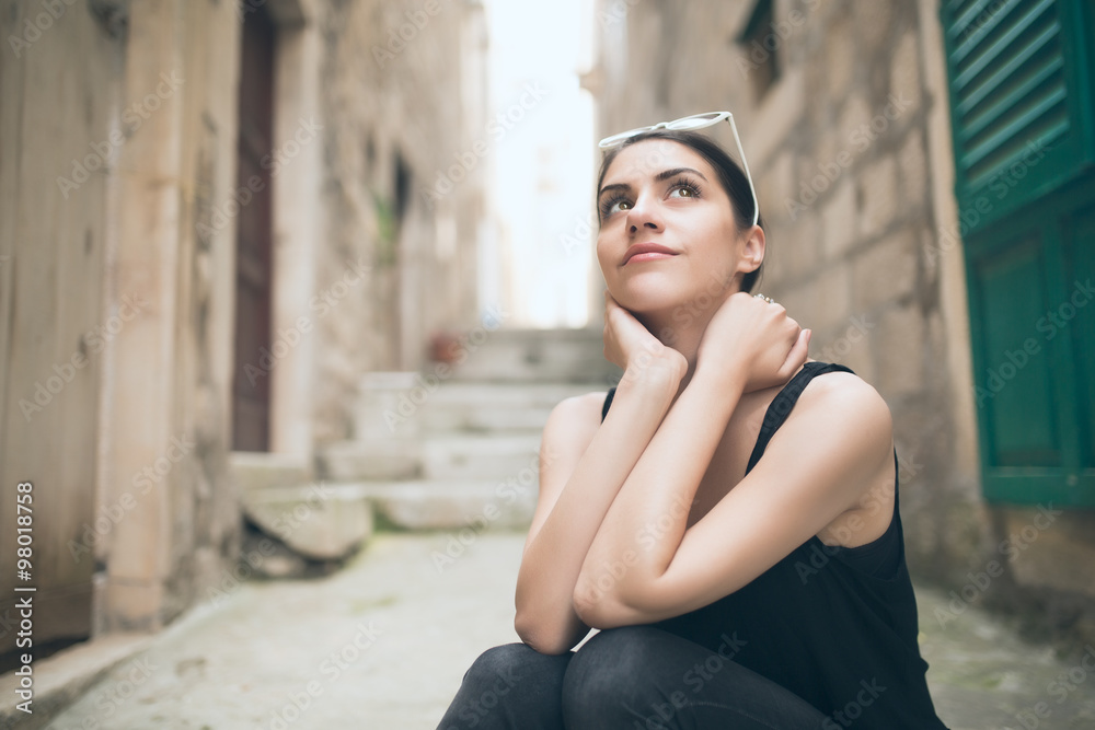 Thinking woman standing pensive contemplating.Thinking woman looking up. Challenge concept.Young brunette looking curious.Smiling content European  woman.Pretty face girl ready for future adventures Stock Photo | Adobe Stock