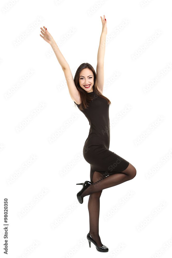 Young brunette woman in black dress on a white background Young brunette woman in black dress on a white background