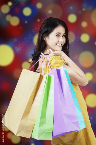 Female model with christmas shopping bags