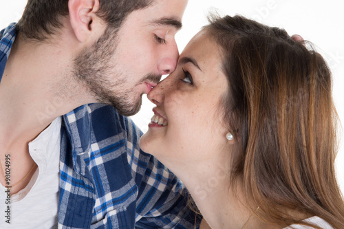 Closeup of a young couple in love and kissing