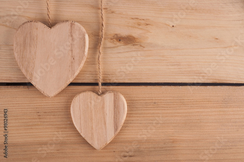 Wooden hearts on the wooden table