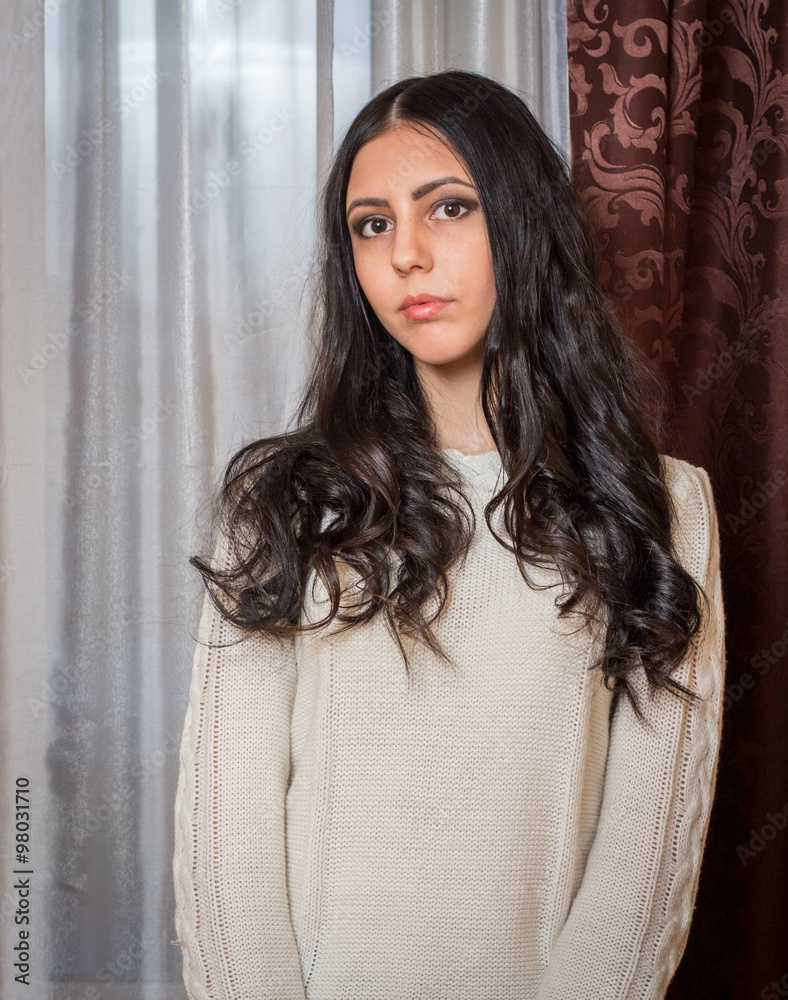 Brunette in a knitted sweater Brunette in a knitted sweater