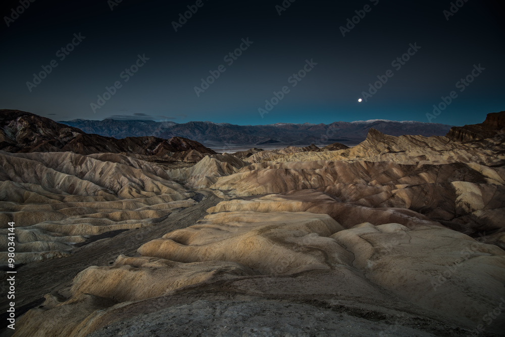 Moonset Over Rock Formations at Zabriskie Point