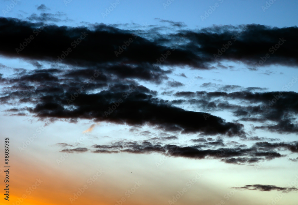 Fototapeta premium Horizontal vibrant dramatic sunset cloudscape background backdro