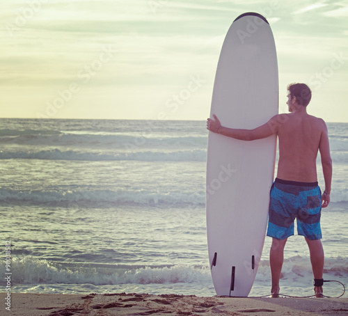 surfer and surfboard on the beach