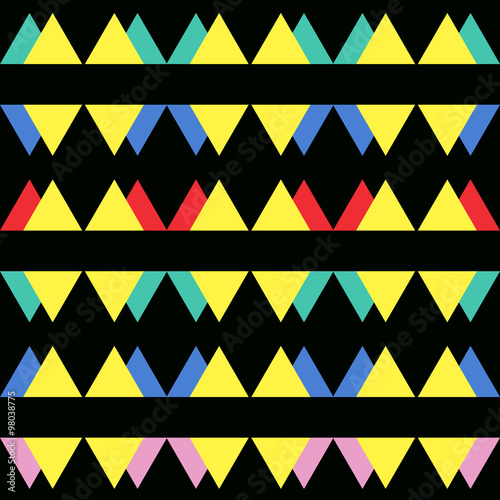 Seamless vintage abstract pattern with triangles in the style of 80's. Fashion background in Memphis.