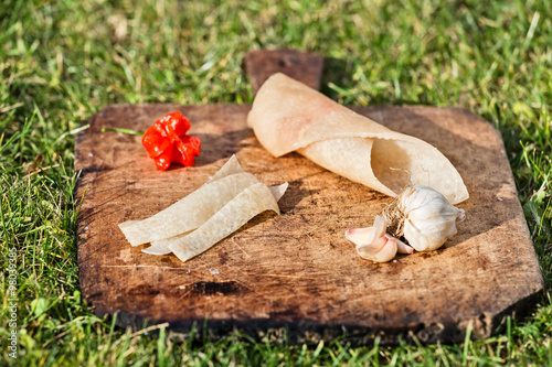 Pork skin on wooden plate