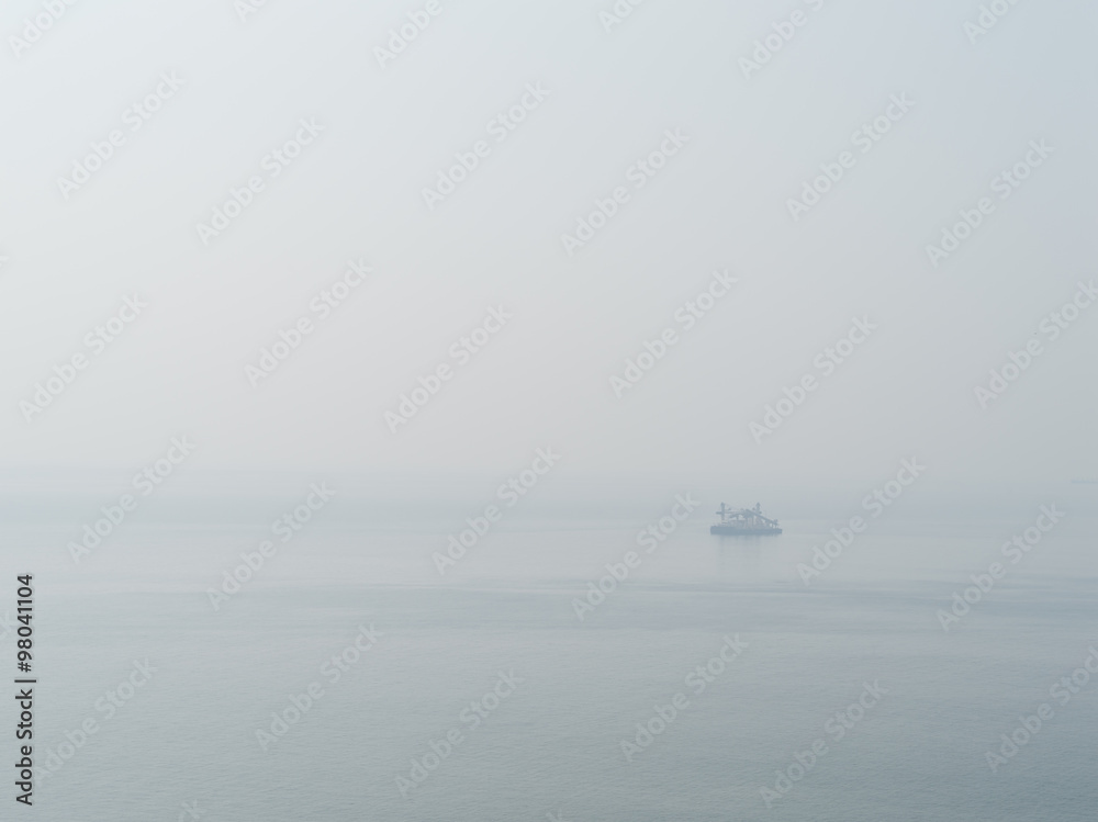 Horizontal sparse pale lonely ship in white ocean background bac