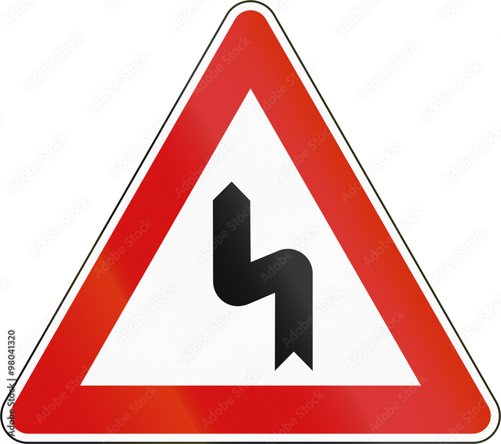 Slovenia road sign - Double bend, first to left Slovenia road sign - Double bend, first to left