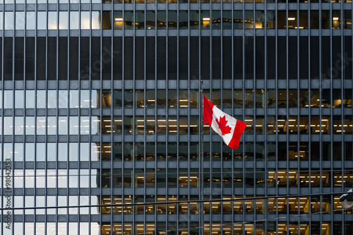 Photography Canadian flag and modern office building in downtown Toronto