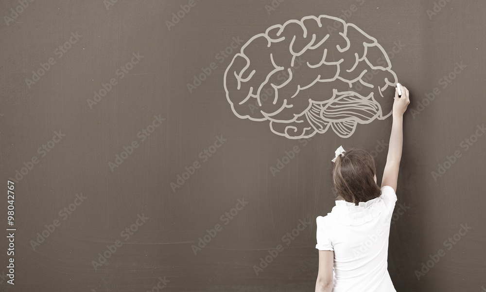 School girl at blackboard