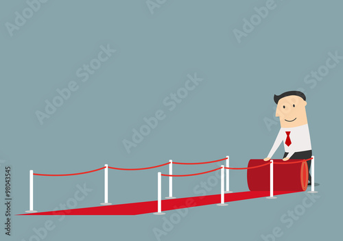 Businessman rolling out the red carpet