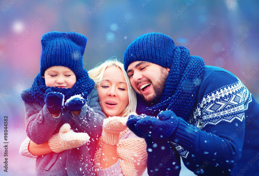 portrait of happy family blowing winter snow Stock 写真 | Adobe Stock