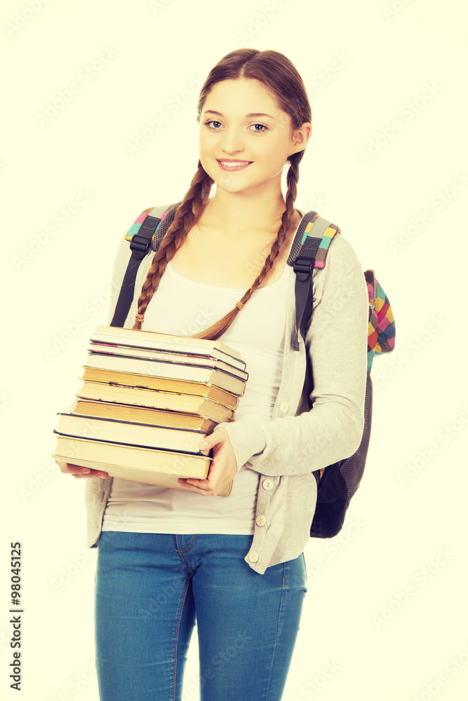 Beautiful teenager with backpack and books. Beautiful teenager with backpack and books.