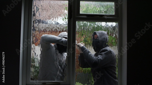  2 masked burglars breaking and entering into a victim's home