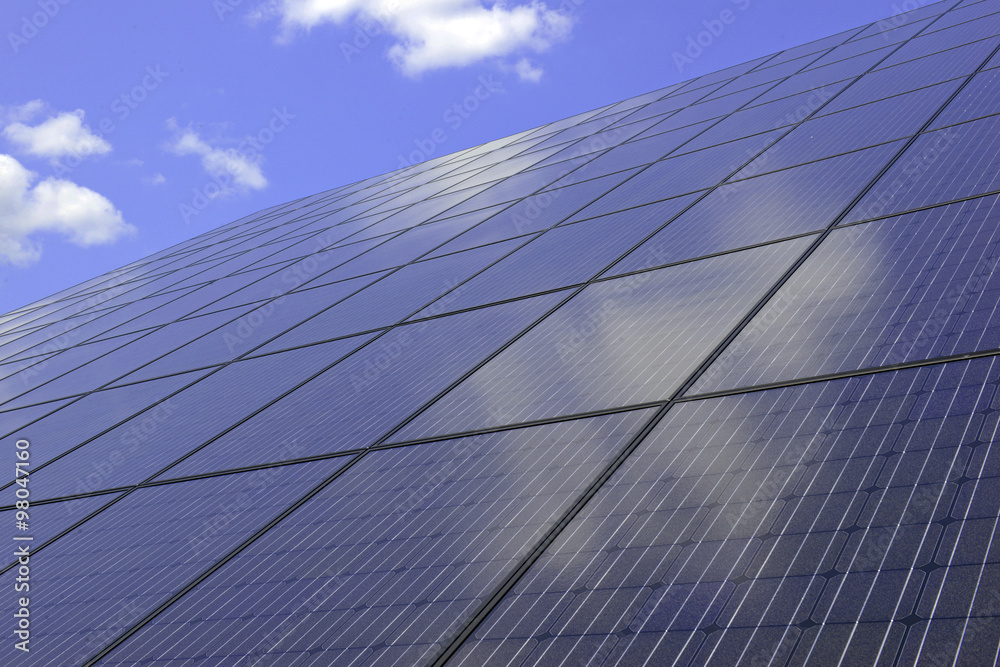 Photovoltaic system with solar panels and blue sky Photovoltaic system with solar panels and blue sky