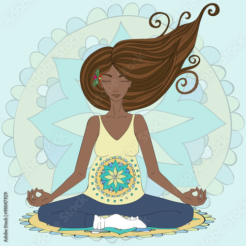 Pregnant black woman practicing lotus asana in meditation.