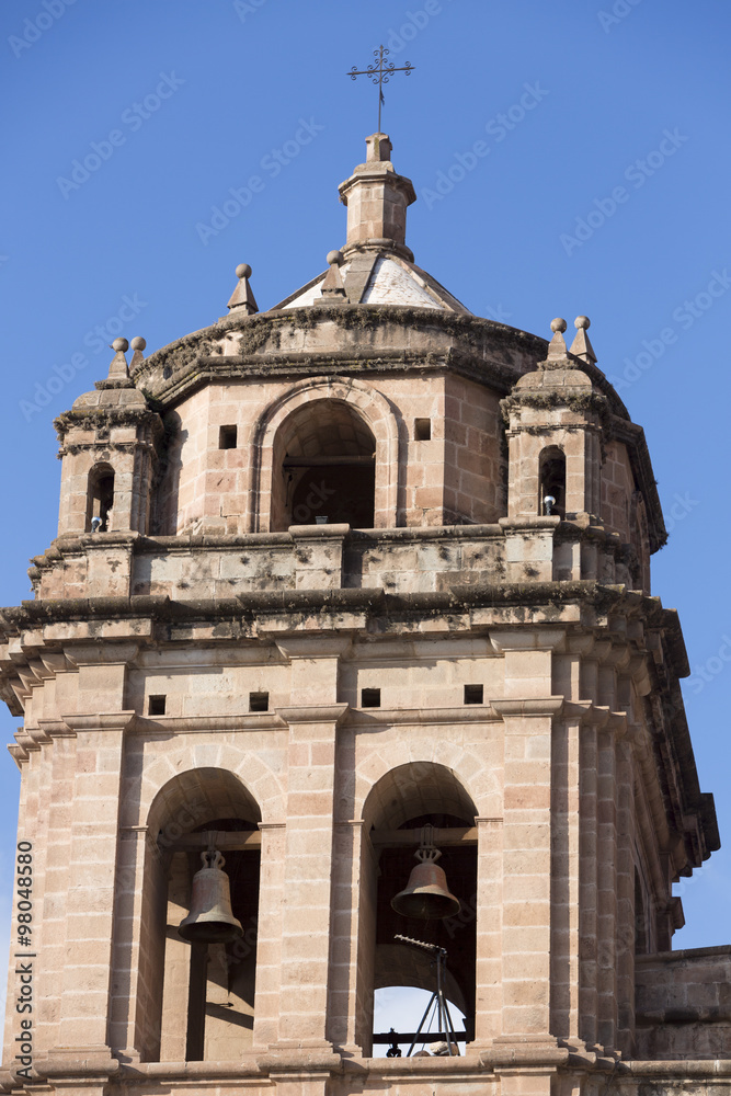 Tower and dome of the historic Iglesia de la Compania in  Cusco