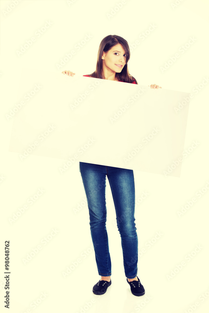 Happy woman holding empty banner. Happy woman holding empty banner.