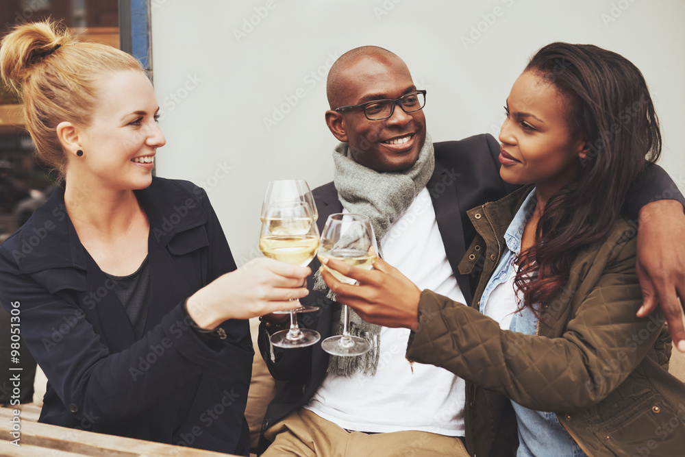 Three multi ethnic friends having a good time Three multi ethnic friends having a good time