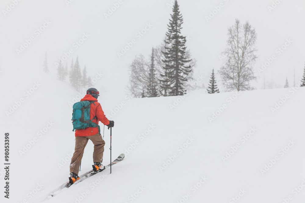 Man skiing snowy slope