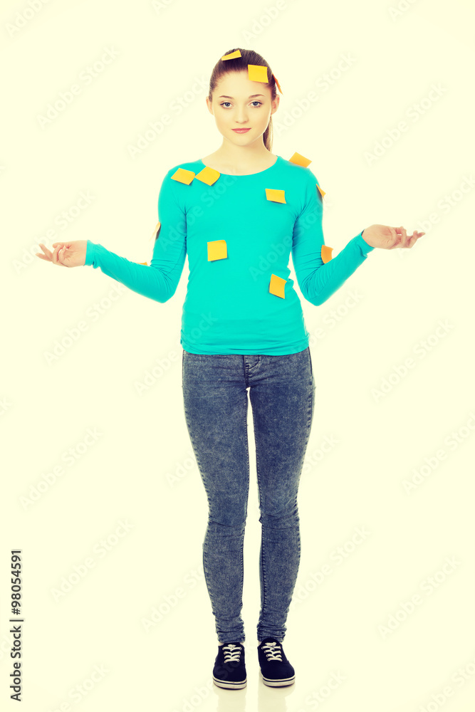 Young woman covered with post it notes. Young woman covered with post it notes.