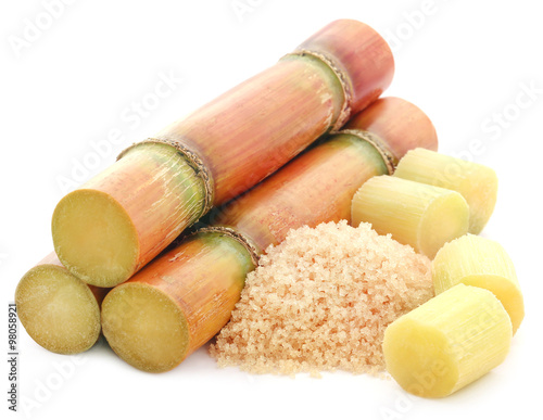Piece of sugarcane with red sugar