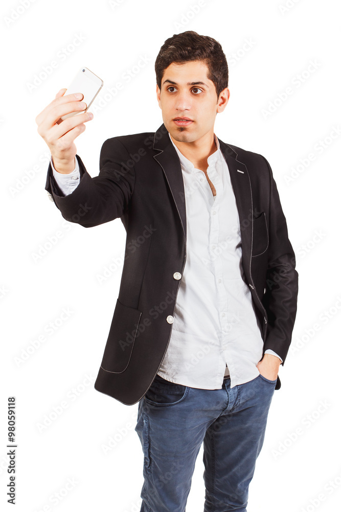 Young man with a phone on the white background Young man with a phone on the white background