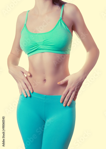 Fit and healthy woman isolated. Color toned image. © Vladimir Arndt