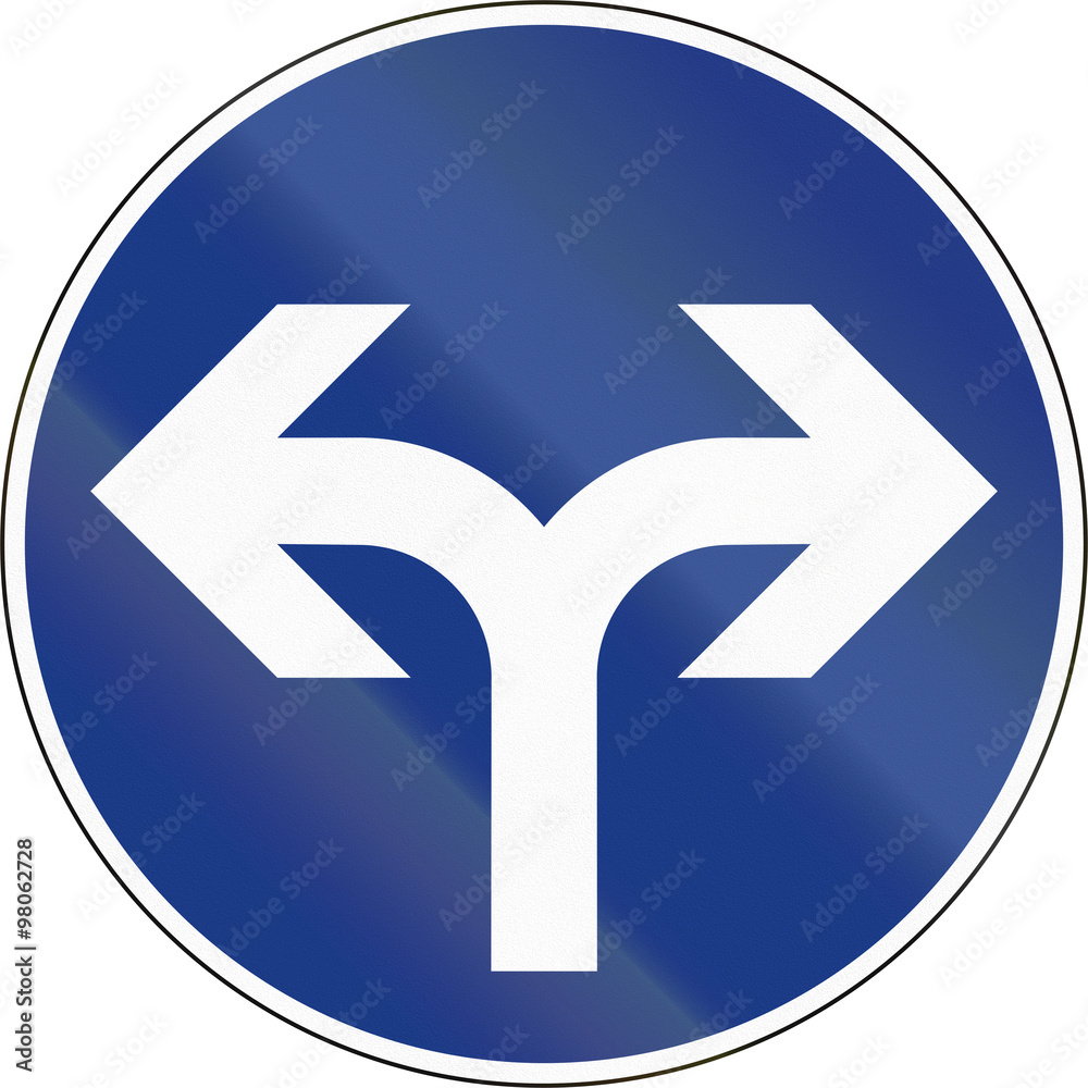 Slovenian mandatory direction sign - Turn left or right Slovenian mandatory direction sign - Turn left or right