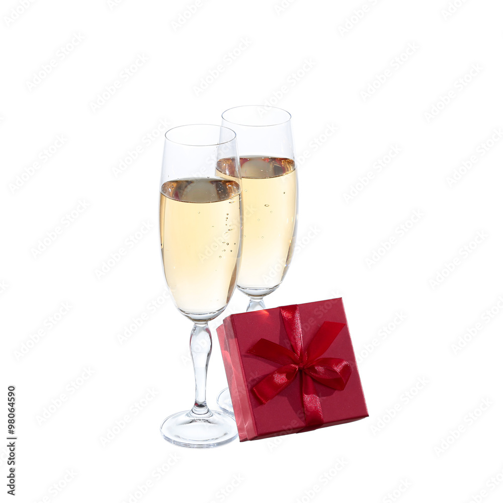 Two champagne glasses and gift on white background Two champagne glasses and gift on white background