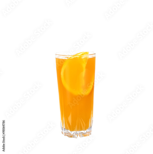 Glass of orange juice with peaces of orange inside