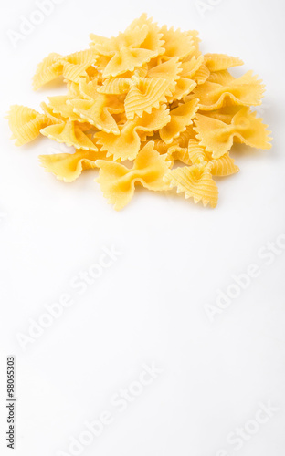 Dried italian bowtie pasta or farfalle over white background