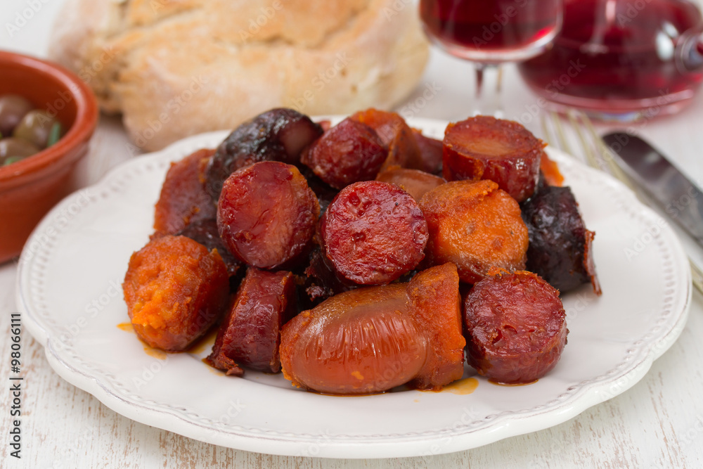 chourico and farinheira on plate and bread with wine chourico and farinheira on plate and bread with wine